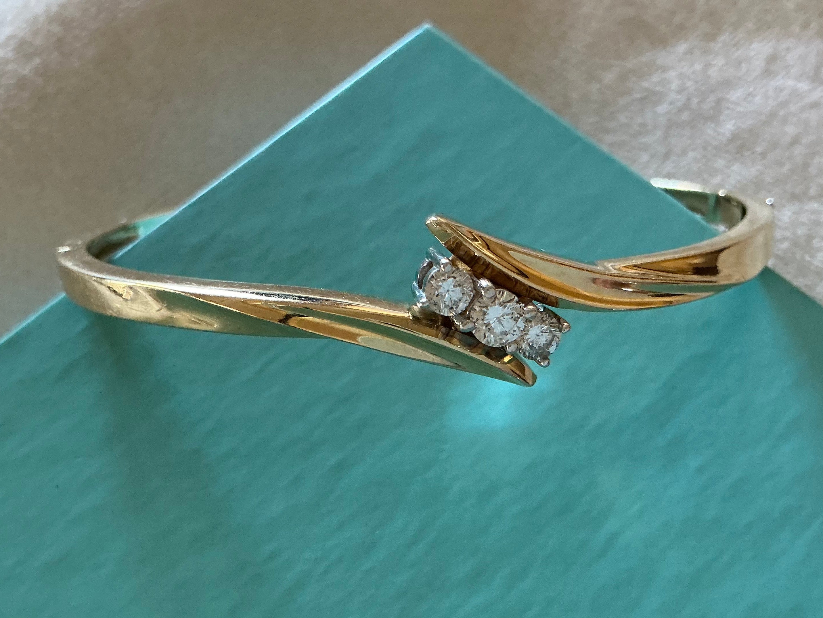 Diamond Bangle Bracelet, set with round brilliant cut natural diamonds on 4 prongs, bracelet opens. Box